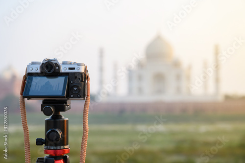Photography Explore India, Digital camera on tripod capturing photo of Taj Mahal in sunset