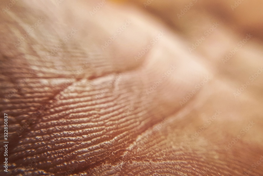 macro healthy and young hand skin texture. Orange human skin background.