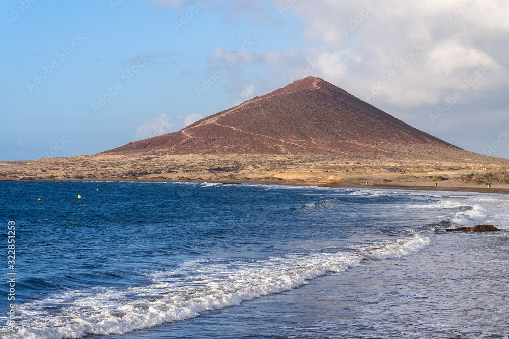 Montana Roja mountain on Tenerife coast near El Medano, Canary Islands, Spain, sunny summer day