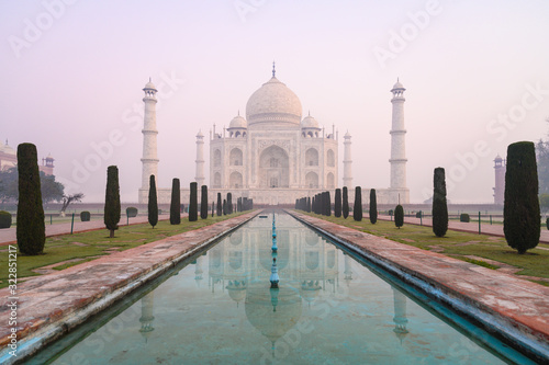 The morning view of Taj Mahal monument reflecting in water of the pool, Agra, India