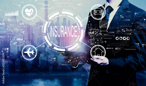 фотографія Insurance concept with businessman holding a tablet computer