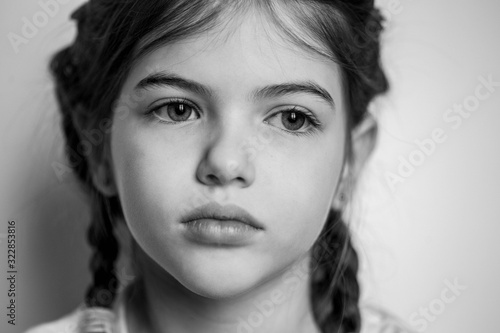 portrait of a young beautiful girl with big eyes, black and white photo