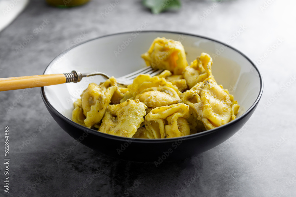Cooked tortellini on a plate, close up pasta, italian food. Cooked tortellini on a plate, close up pasta, italian food.