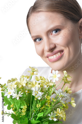 Portrait of beautiful young woman with flowers