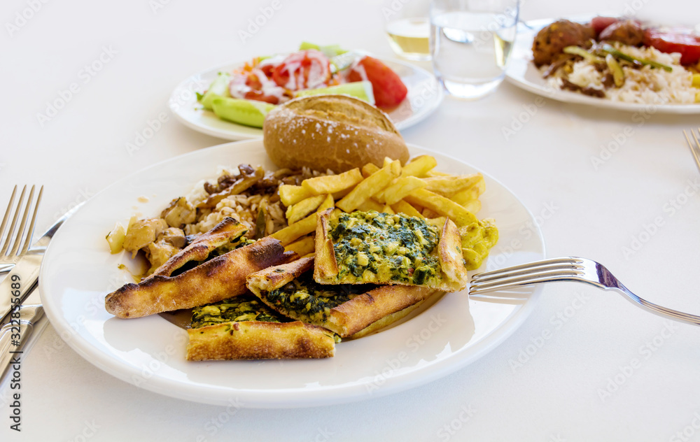 Traditional Turkish Food with Whole Grain Bread ,Salad and French Fries Traditional Turkish Food with Whole Grain Bread ,Salad and French Fries