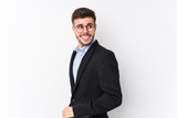 Young caucasian business man posing in a white background isolated Young caucasian business man looks aside smiling, cheerful and pleasant.