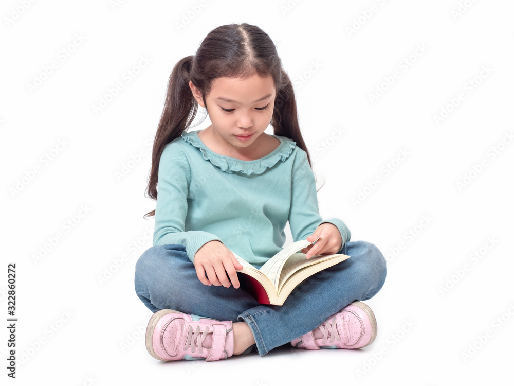 Asian little cute girl 6 years old sitting on floor and reading the book. Preschool lovely kid with the book. Learning and education of kid. Asian little cute girl 6 years old sitting on floor and reading the book. Preschool lovely kid with the book. Learning and education of kid.