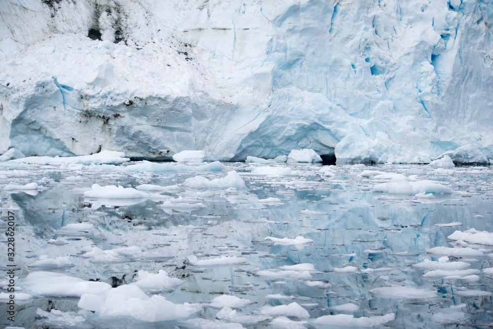 Fototapeta premium Broken melting pieces of ice at Antarctic peninsula, stunning icy scenery landscape in Antarctica