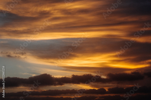 cloudy sunset colourful orange red sky © javierdavidmillan