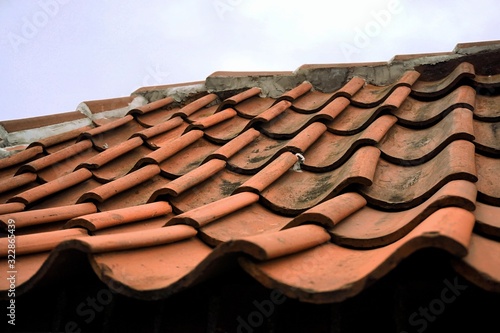 The roof is covered with old tiles. update required. broken tiles in places.