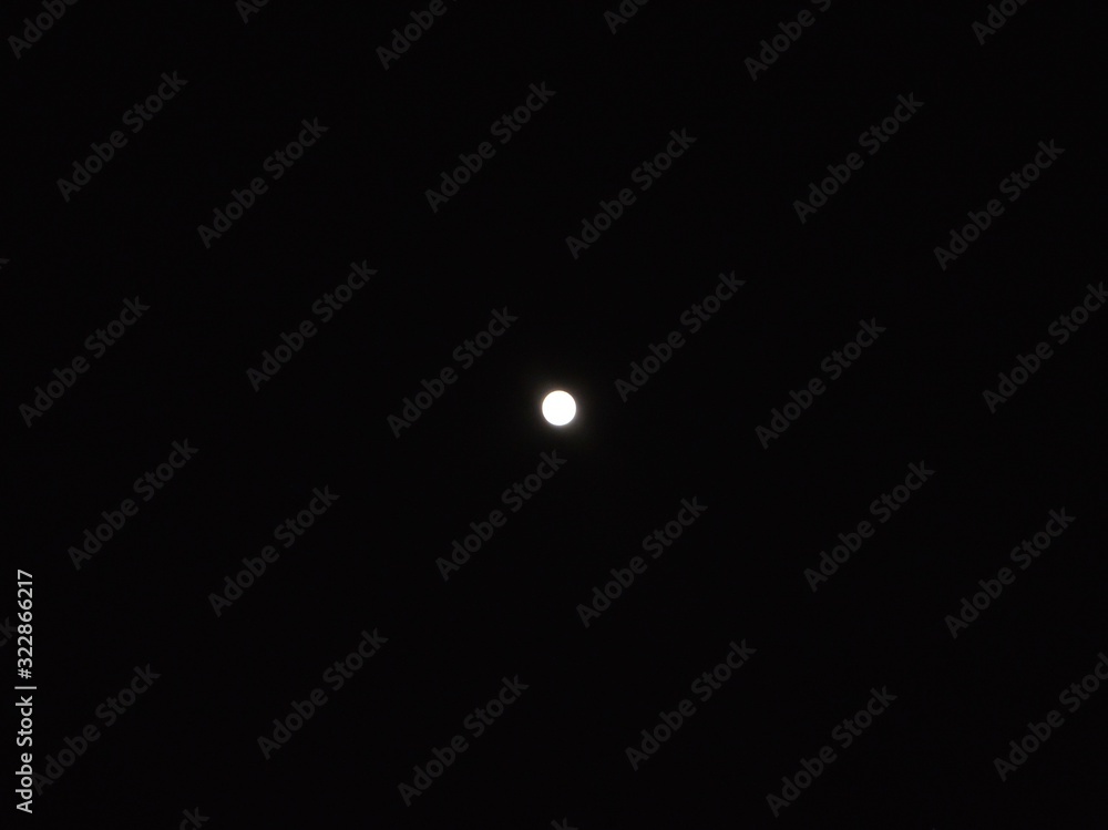 a beautiful luminous moon settled in the night sky a beautiful luminous moon settled in the night sky