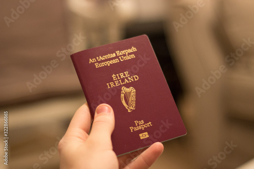 Bild auf Leinwand irish passport being held in hand