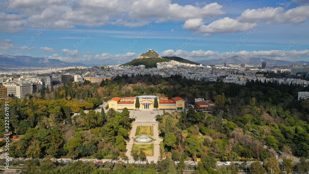 Naklejka premium Aerial drone photo of renovated public neoclassic building of Zappeion used for events and meetings in the National Gardens of Athens and Lycabettus hill aligned at the background, Greece