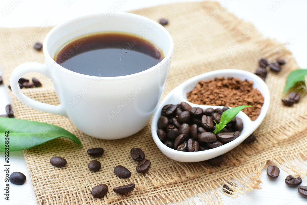 Coffee beans, accompanied by processed coffee powder Coffee beans, accompanied by processed coffee powder