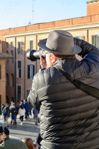 man in hard hat with camera