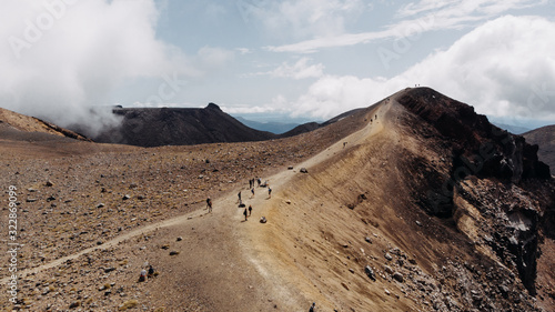 hikers walking top hill