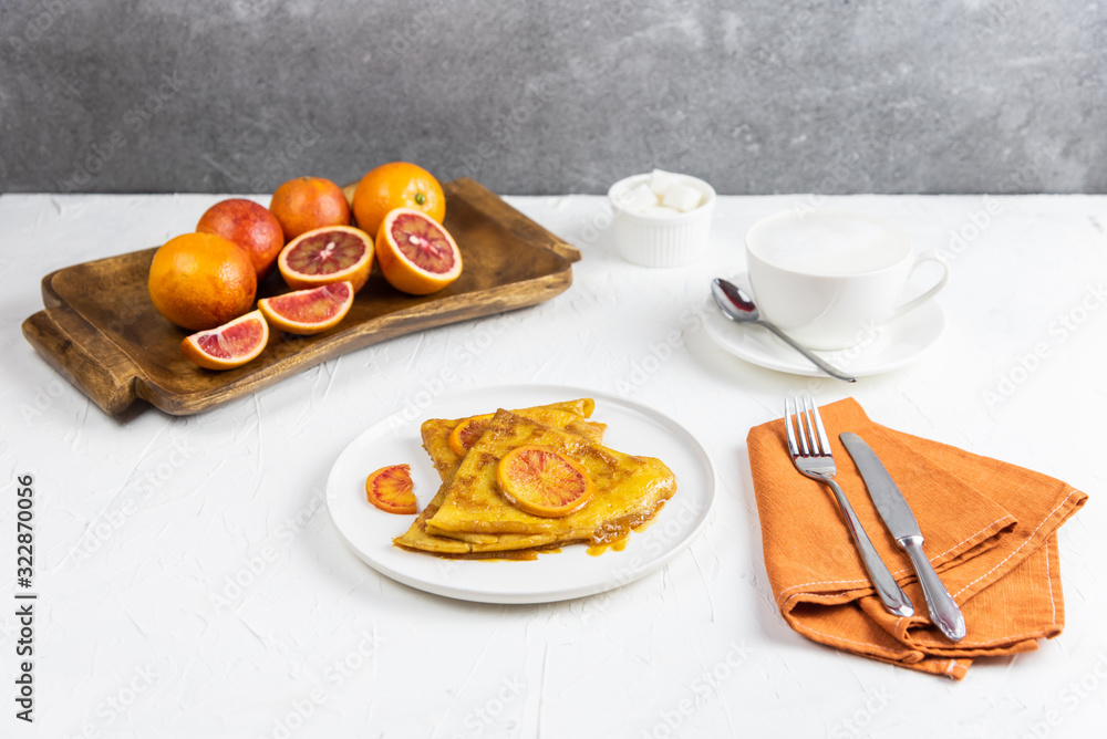 Breakfast with a crepe suzette and cappuccino