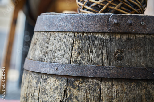 Old wooden barrel on a brown background photo