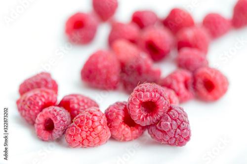 Plate of fresh organic raspberries, healthy diet concept