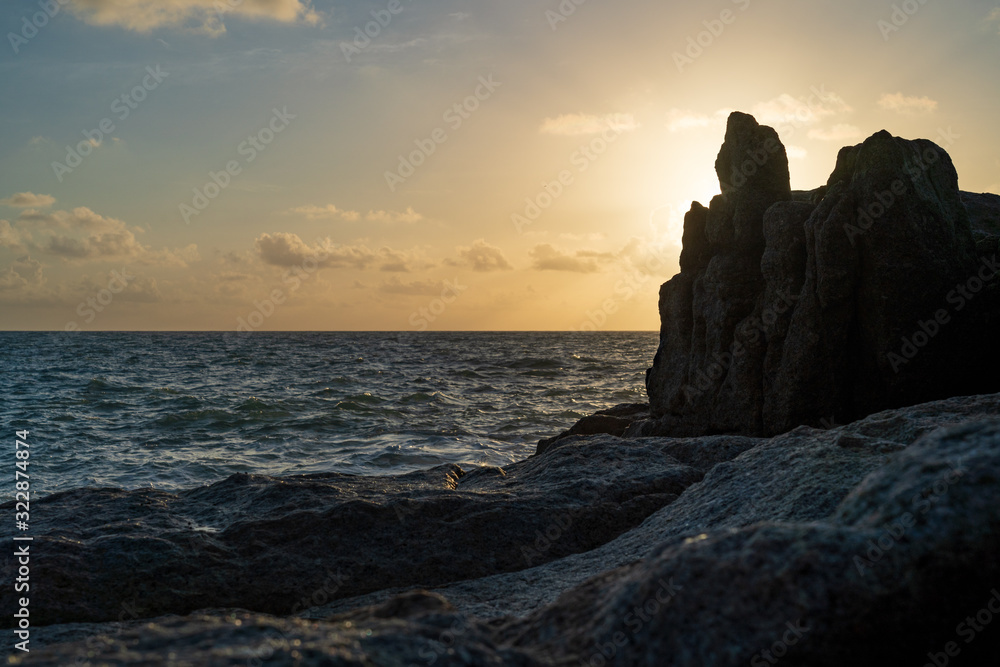 The sun rising from the cliffs by the sea The sun rising from the cliffs by the sea
