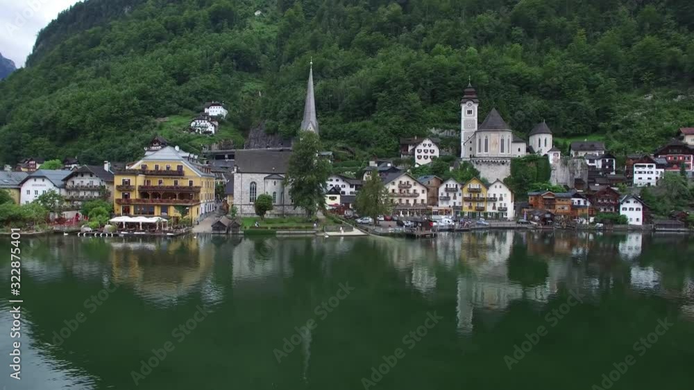 Wonderful 4k drone aerial flight over ancient house mirror surface lake beach in wild nature mountain forest landscape Wonderful 4k drone aerial flight over ancient house mirror surface lake beach in wild nature mountain forest landscape