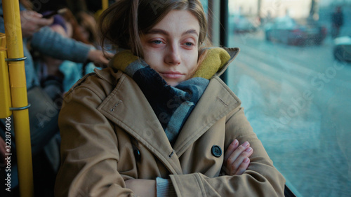 Sick young woman coughs sneezes on the tram cold autumn day flu season disease fever grippe health illness infection influenza migraine sickness slow motion