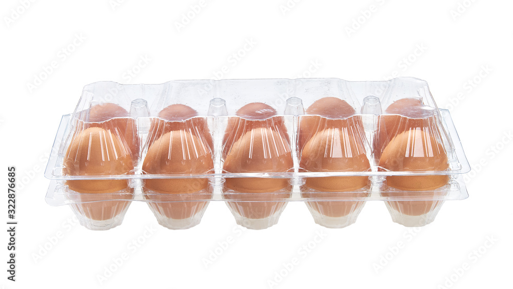Egg packing. Chicken eggs in a transparent package isolated on white background. Egg packing. Chicken eggs in a transparent package isolated on white background.