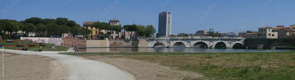 Rimini – panorama from XXV April Park of Bridge of Tiberius with the skyscraper in the background