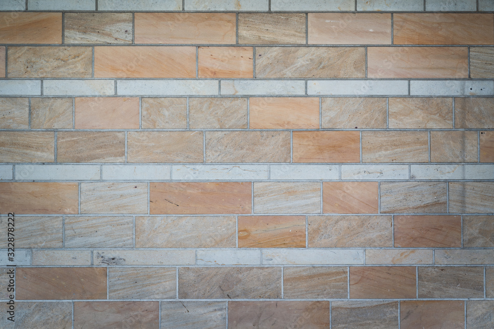 Fototapeta premium sandstone wall background texture with copy space