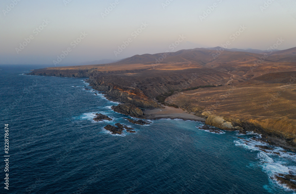 Obraz premium Ajuy, Fuerteventura, Canary Islands Spain - october 2019: the Cuevas de Ajuy, a network of limestone cliffs and caves on the Atlantic ocean coast, once used by pirates. Aerial view