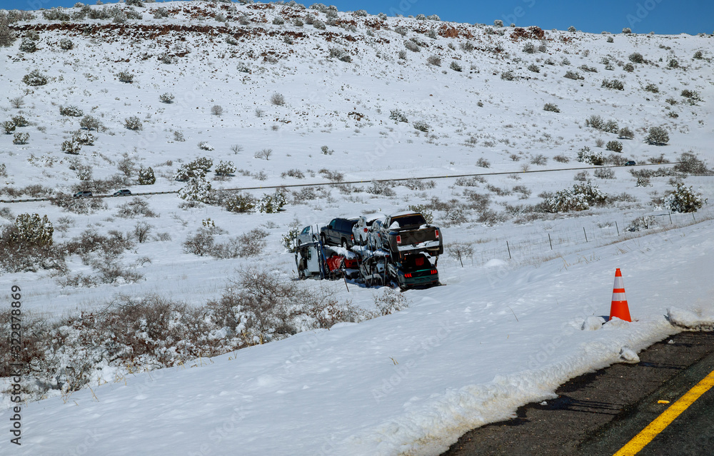 Drift of the car carrier trailer truck on the winter road because of snowy road. Drift of the car carrier trailer truck on the winter road because of snowy road.
