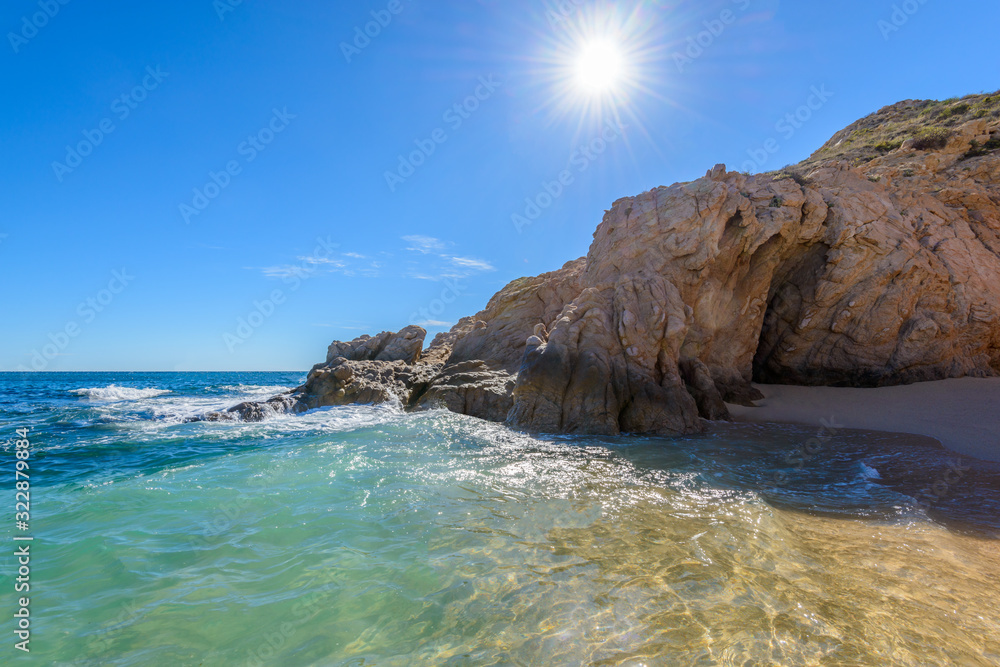 Santa Maria Beach, Cabo San Lucas, Mexico. Different stages of the fantastic ocean waves. Rocky and sandy beach.
