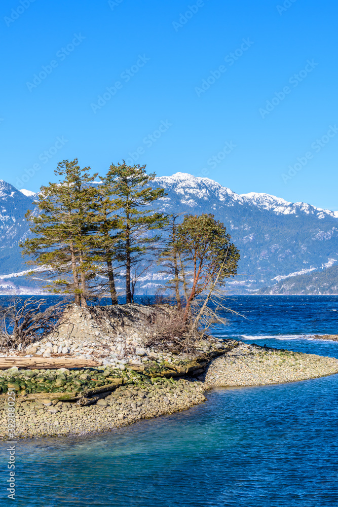 Fantastic view over ocean, snow mountain and rocks at Furry Creek Dive Site in Vancouver, Canada. Fantastic view over ocean, snow mountain and rocks at Furry Creek Dive Site in Vancouver, Canada.