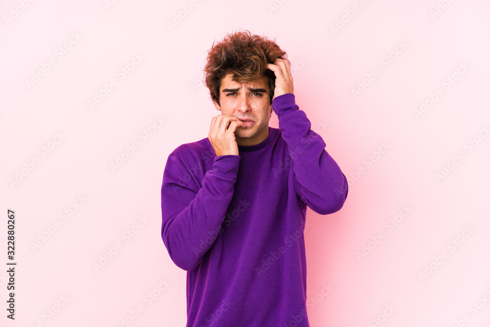 Young caucasian man against a pink background isolated whining and crying disconsolately. Young caucasian man against a pink background isolated whining and crying disconsolately.
