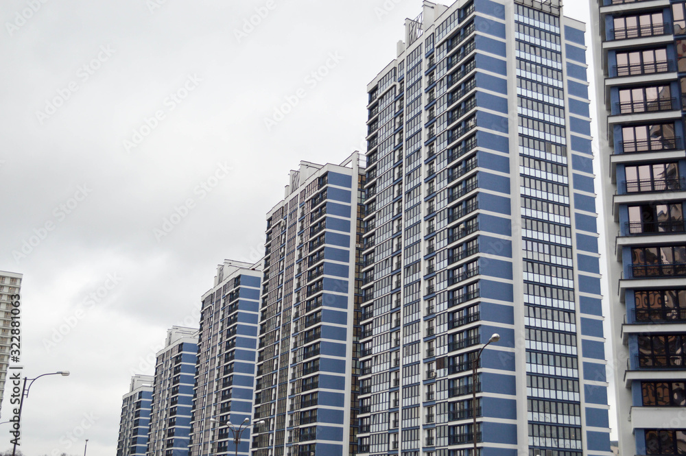 New modern tall blue glass multi-storey comfortable urban monolithic frame houses buildings skyscrapers new buildings in the big city of the megalopolis