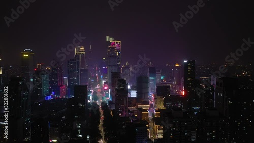 Wallpaper Mural flight over nanjing city center downtown night illuminated traffic streets aerial panorama 4k china Torontodigital.ca