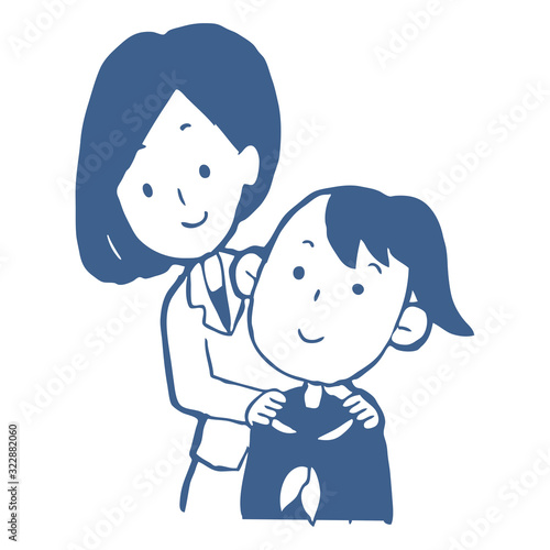 女子学生の肩に手を置く先生