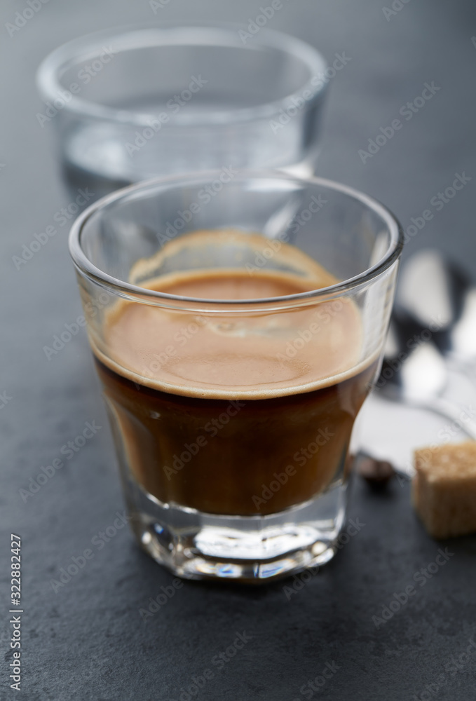Coffee with milk on dark stone background. Close up. Coffee with milk on dark stone background. Close up.