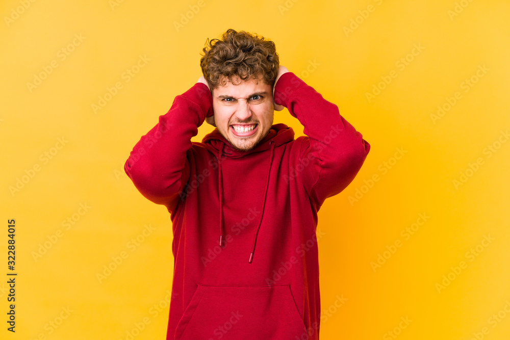 covering ears with hands trying not to hear too loud sound. covering ears with hands trying not to hear too loud sound.