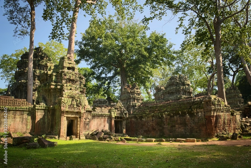 Western gate of the inner courtyard of Ta Prohm temple ruins, located in Angkor Wat complex near Siem Reap, Cambodia.