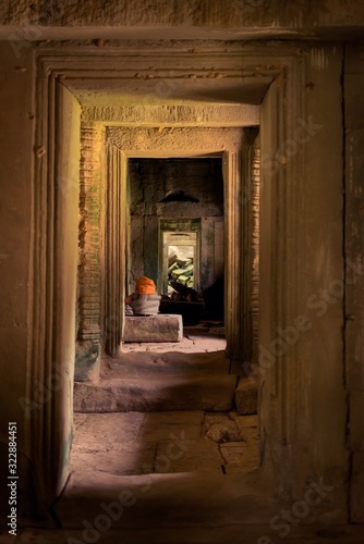 Interior doorway at Ta Prohm temple ruins, located in Angkor Wat complex near Siem Reap, Cambodia.