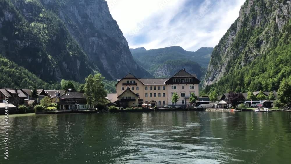 Amazing 4k panorama view on cozy villa house in small Austrian village by lake pine tree wild nature mountain landscape Amazing 4k panorama view on cozy villa house in small Austrian village by lake pine tree wild nature mountain landscape