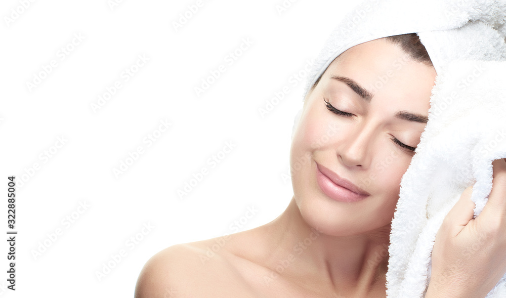 Beautiful woman with clean fresh skin and towel on head. Skin care and beauty concept Beautiful woman with clean fresh skin and towel on head. Skin care and beauty concept