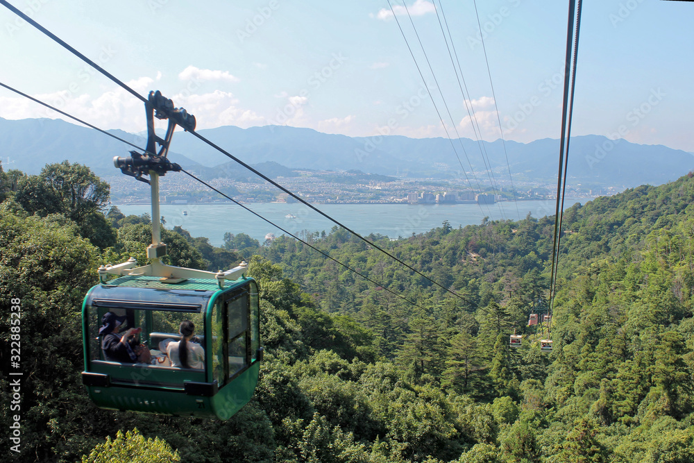 Miyajima, Japan - July 20, 2019: Miyajima Ropeway car in Hatsukaichi, Hiroshima which climbs Mount Misen of Miyajima Island. Cable car over mountain