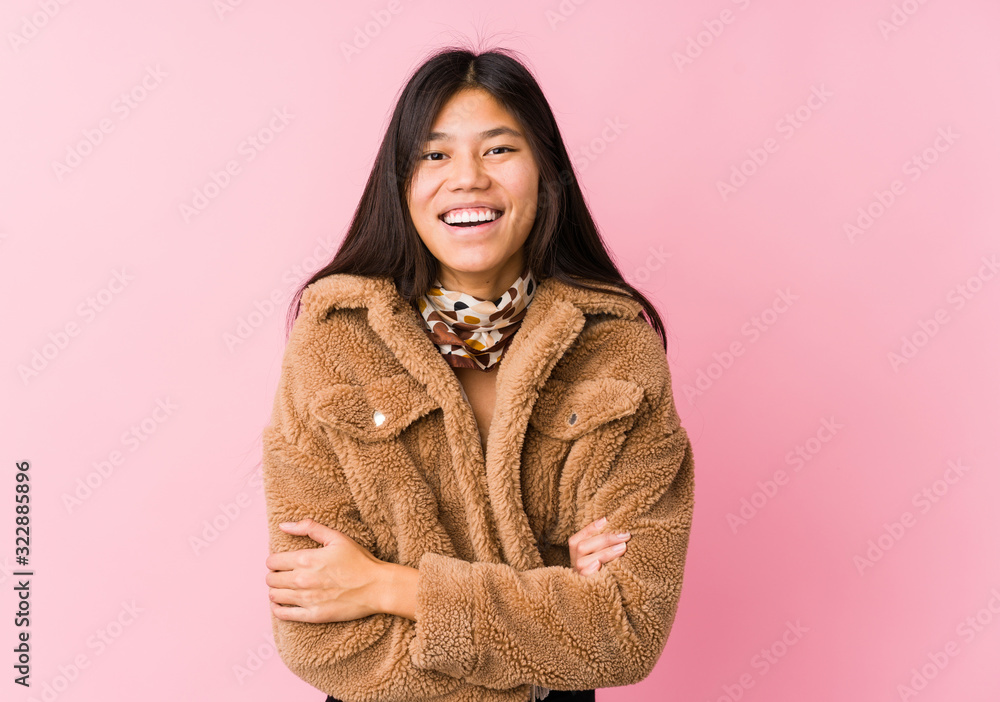 Young asian woman laughing and having fun. Young asian woman laughing and having fun.