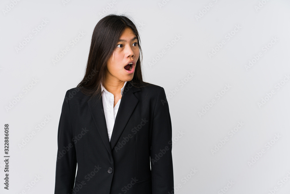Young asian business woman being shocked because of something she has seen. Young asian business woman being shocked because of something she has seen.
