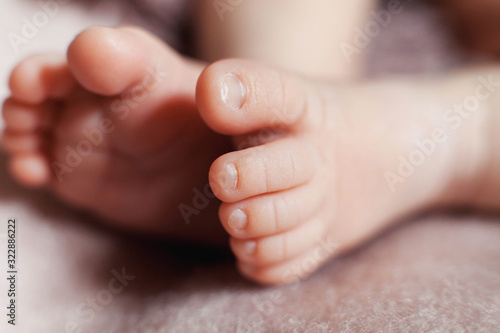 Close up photo of newborn baby feet.