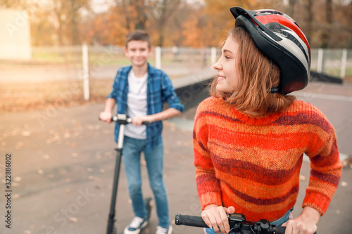 Active teenagers riding kic...