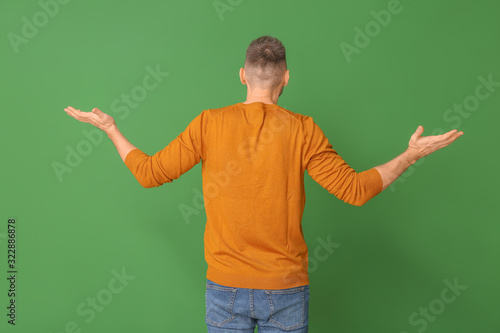 Helpless man on color backg...