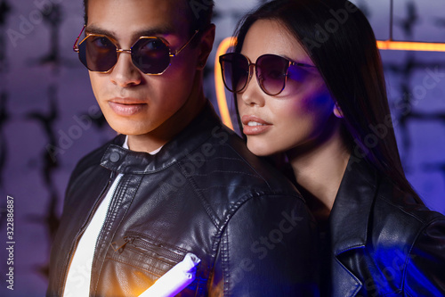 Stylish young couple on dar...